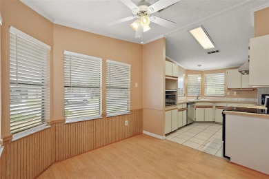 This 2 bedroom 2 bath home is situated on an oversized lot just on Bay Tree Golf Course in Florida - for sale on GolfHomes.com, golf home, golf lot