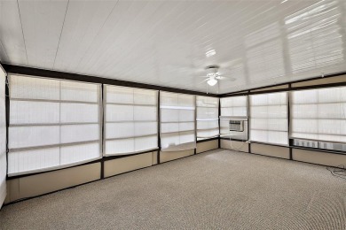 This 2 bedroom 2 bath home is situated on an oversized lot just on Bay Tree Golf Course in Florida - for sale on GolfHomes.com, golf home, golf lot