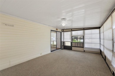 This 2 bedroom 2 bath home is situated on an oversized lot just on Bay Tree Golf Course in Florida - for sale on GolfHomes.com, golf home, golf lot