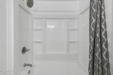 Welcome to this fully renovated, move-in ready ranch home in on Diamondhead Country Club in Mississippi - for sale on GolfHomes.com, golf home, golf lot