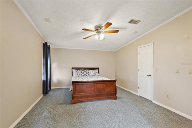 This 2 bedroom 2 bath home is situated on an oversized lot just on Bay Tree Golf Course in Florida - for sale on GolfHomes.com, golf home, golf lot