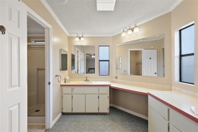 This 2 bedroom 2 bath home is situated on an oversized lot just on Bay Tree Golf Course in Florida - for sale on GolfHomes.com, golf home, golf lot