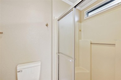 This 2 bedroom 2 bath home is situated on an oversized lot just on Bay Tree Golf Course in Florida - for sale on GolfHomes.com, golf home, golf lot