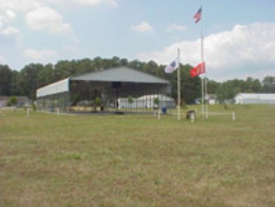 HUGE LOT!!!  This lot has the square footage of two lots.  But on Captains Cove Golf and Yacht Club in Virginia - for sale on GolfHomes.com, golf home, golf lot