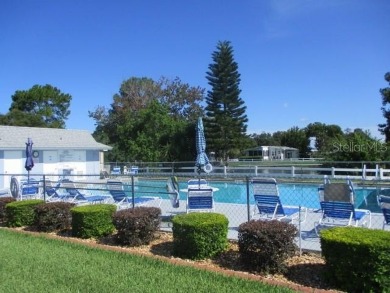 This 2 bedroom 2 bath home is situated on an oversized lot just on Bay Tree Golf Course in Florida - for sale on GolfHomes.com, golf home, golf lot