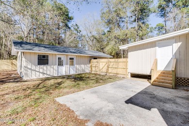 Welcome to this fully renovated, move-in ready ranch home in on Diamondhead Country Club in Mississippi - for sale on GolfHomes.com, golf home, golf lot