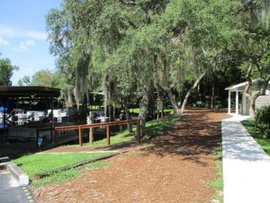 This 2 bedroom 2 bath home is situated on an oversized lot just on Bay Tree Golf Course in Florida - for sale on GolfHomes.com, golf home, golf lot