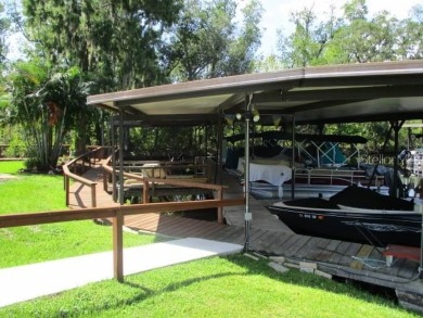 This 2 bedroom 2 bath home is situated on an oversized lot just on Bay Tree Golf Course in Florida - for sale on GolfHomes.com, golf home, golf lot