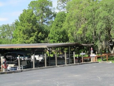 This 2 bedroom 2 bath home is situated on an oversized lot just on Bay Tree Golf Course in Florida - for sale on GolfHomes.com, golf home, golf lot