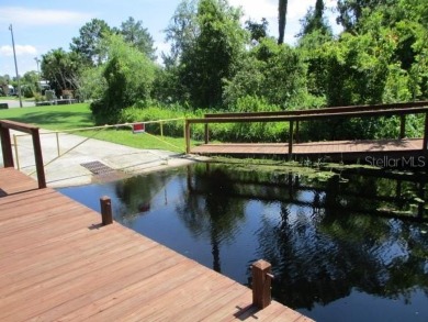 This 2 bedroom 2 bath home is situated on an oversized lot just on Bay Tree Golf Course in Florida - for sale on GolfHomes.com, golf home, golf lot