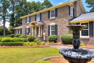 A stately two-story brick residence, exuding timeless elegance on Players Course At Wyboo Plantation in South Carolina - for sale on GolfHomes.com, golf home, golf lot