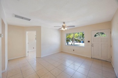 One or more photo(s) has been virtually staged. Charming on Mangrove Bay Golf Course in Florida - for sale on GolfHomes.com, golf home, golf lot