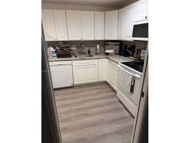 Excellent unit overlooking the golf course and lake on Palm-Aire Country Club and Resort - The Oaks in Florida - for sale on GolfHomes.com, golf home, golf lot