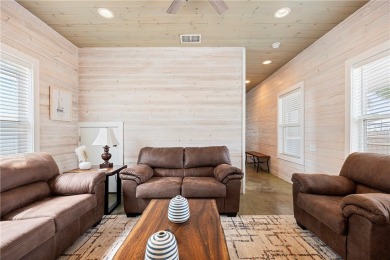 Island charm meets modern comfort! This beautifully maintained on Palmilla Beach Golf Club in Texas - for sale on GolfHomes.com, golf home, golf lot