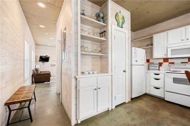 Island charm meets modern comfort! This beautifully maintained on Palmilla Beach Golf Club in Texas - for sale on GolfHomes.com, golf home, golf lot