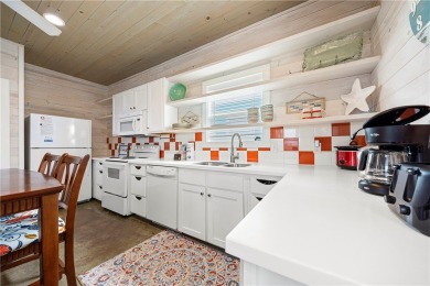 Island charm meets modern comfort! This beautifully maintained on Palmilla Beach Golf Club in Texas - for sale on GolfHomes.com, golf home, golf lot