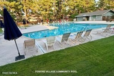 This stunning 1.4-acre waterfront lot on Lake Blum in the on Foxfire Golf and Country Club in North Carolina - for sale on GolfHomes.com, golf home, golf lot