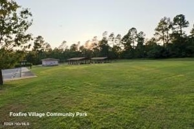 This stunning 1.4-acre waterfront lot on Lake Blum in the on Foxfire Golf and Country Club in North Carolina - for sale on GolfHomes.com, golf home, golf lot