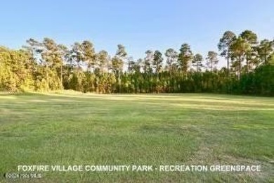 This stunning 2.67-acre parcel is a combination of two lots, lot on Foxfire Golf and Country Club in North Carolina - for sale on GolfHomes.com, golf home, golf lot