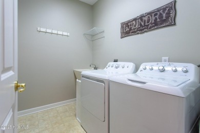 This beautiful 3-bedroom, 2.5-bath home is located on Golf on Sound Golf Links at Albemarle Plantation in North Carolina - for sale on GolfHomes.com, golf home, golf lot