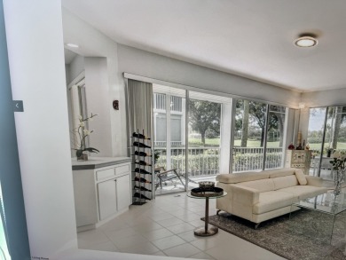 Updated bright and light first floor condo with lake and golf on  in Florida - for sale on GolfHomes.com, golf home, golf lot