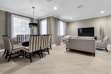 Immaculate corner residence with serene views of lush greenery on Weston Hills Country Club in Florida - for sale on GolfHomes.com, golf home, golf lot