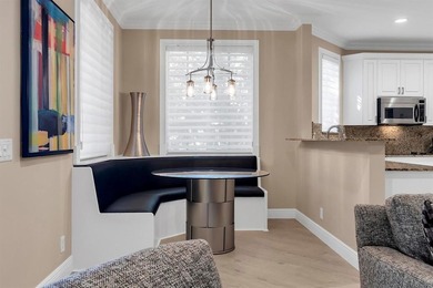 Immaculate corner residence with serene views of lush greenery on Weston Hills Country Club in Florida - for sale on GolfHomes.com, golf home, golf lot