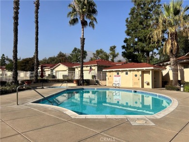 Experience luxury living in this exquisite end-unit home nestled on Upland Hills Country Club in California - for sale on GolfHomes.com, golf home, golf lot