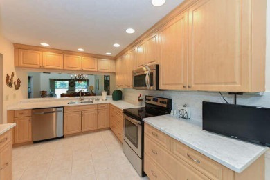 Located in the very active Eaglewood Golf and Tennis Community on Eagle Wood Golf Course in Florida - for sale on GolfHomes.com, golf home, golf lot