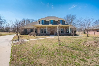 This is a beautifully appointed custom home in Lake Fork Country on Lake Fork Golf Club - Wood County in Texas - for sale on GolfHomes.com, golf home, golf lot
