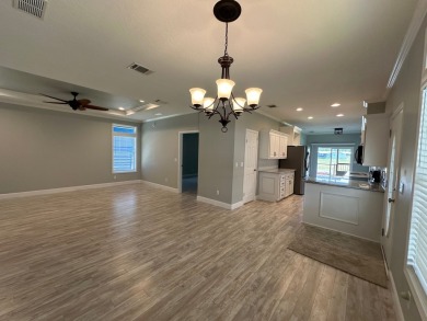 Located in the Foley Grove, a charming land-leased 55+ on Gulf Links Executive Golf Course in Alabama - for sale on GolfHomes.com, golf home, golf lot