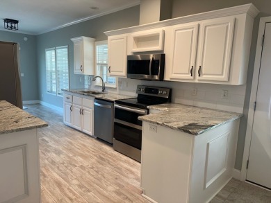 Located in the Foley Grove, a charming land-leased 55+ on Gulf Links Executive Golf Course in Alabama - for sale on GolfHomes.com, golf home, golf lot