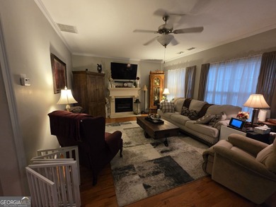 Welcome to this beautifully maintained all-brick home, ideally on Canongate At Georgia National Golf Club in Georgia - for sale on GolfHomes.com, golf home, golf lot