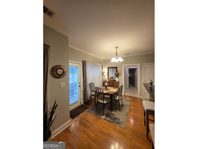 Welcome to this beautifully maintained all-brick home, ideally on Canongate At Georgia National Golf Club in Georgia - for sale on GolfHomes.com, golf home, golf lot