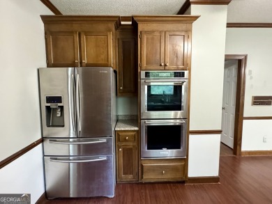 Spacious 4BR/3BA home with a Bonus Room and Study! All located on Canongate At Healy Point Country Club in Georgia - for sale on GolfHomes.com, golf home, golf lot