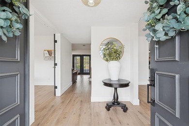 Welcome to this beautifully updated pool home overlooking the on Northdale Golf and Tennis Club in Florida - for sale on GolfHomes.com, golf home, golf lot