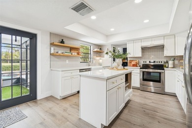 Welcome to this beautifully updated pool home overlooking the on Northdale Golf and Tennis Club in Florida - for sale on GolfHomes.com, golf home, golf lot