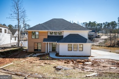 This gorgeous new construction is directly on Osprey Pointe Pond on Harbor Club Golf and Country Club in Georgia - for sale on GolfHomes.com, golf home, golf lot