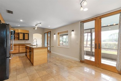 Perfectly positioned in the heart of Palm Coast, yet a world on The Grand Club - Pine Lakes Course in Florida - for sale on GolfHomes.com, golf home, golf lot