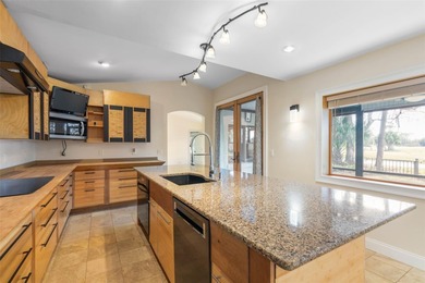 Perfectly positioned in the heart of Palm Coast, yet a world on The Grand Club - Pine Lakes Course in Florida - for sale on GolfHomes.com, golf home, golf lot