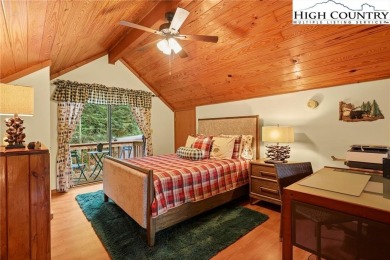 Well-loved mountain home tucked in the woods along the golf on Land Harbor Golf Course in North Carolina - for sale on GolfHomes.com, golf home, golf lot