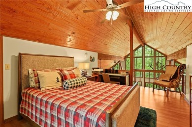 Well-loved mountain home tucked in the woods along the golf on Land Harbor Golf Course in North Carolina - for sale on GolfHomes.com, golf home, golf lot