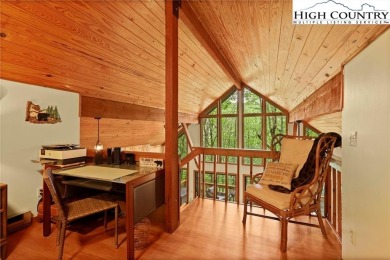 Well-loved mountain home tucked in the woods along the golf on Land Harbor Golf Course in North Carolina - for sale on GolfHomes.com, golf home, golf lot