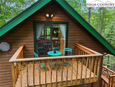 Well-loved mountain home tucked in the woods along the golf on Land Harbor Golf Course in North Carolina - for sale on GolfHomes.com, golf home, golf lot