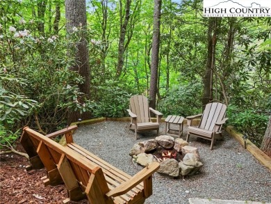 Well-loved mountain home tucked in the woods along the golf on Land Harbor Golf Course in North Carolina - for sale on GolfHomes.com, golf home, golf lot