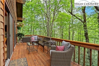 Well-loved mountain home tucked in the woods along the golf on Land Harbor Golf Course in North Carolina - for sale on GolfHomes.com, golf home, golf lot