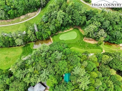 Well-loved mountain home tucked in the woods along the golf on Land Harbor Golf Course in North Carolina - for sale on GolfHomes.com, golf home, golf lot