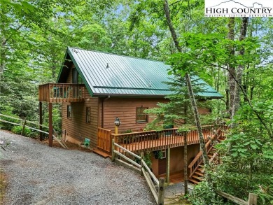 Well-loved mountain home tucked in the woods along the golf on Land Harbor Golf Course in North Carolina - for sale on GolfHomes.com, golf home, golf lot
