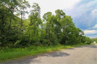 This wooded and conveniently located lot in the heart of Breezy on Breezy Point Golf Course Resort in Minnesota - for sale on GolfHomes.com, golf home, golf lot