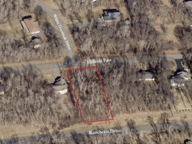 This wooded and conveniently located lot in the heart of Breezy on Breezy Point Golf Course Resort in Minnesota - for sale on GolfHomes.com, golf home, golf lot